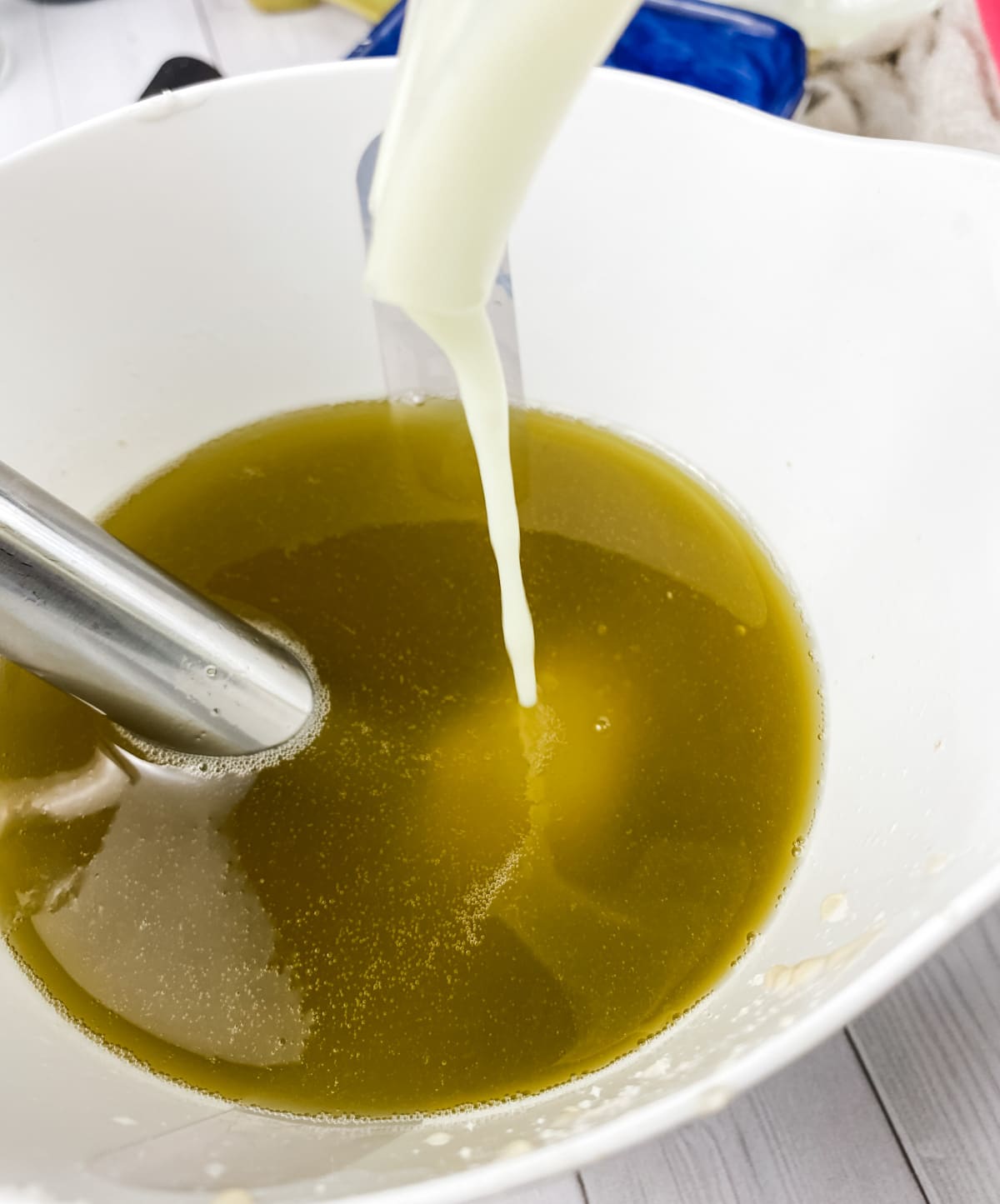 pouring lye into oils.