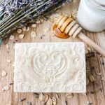 bar of goat milk soap with milk, oatmeal and honey