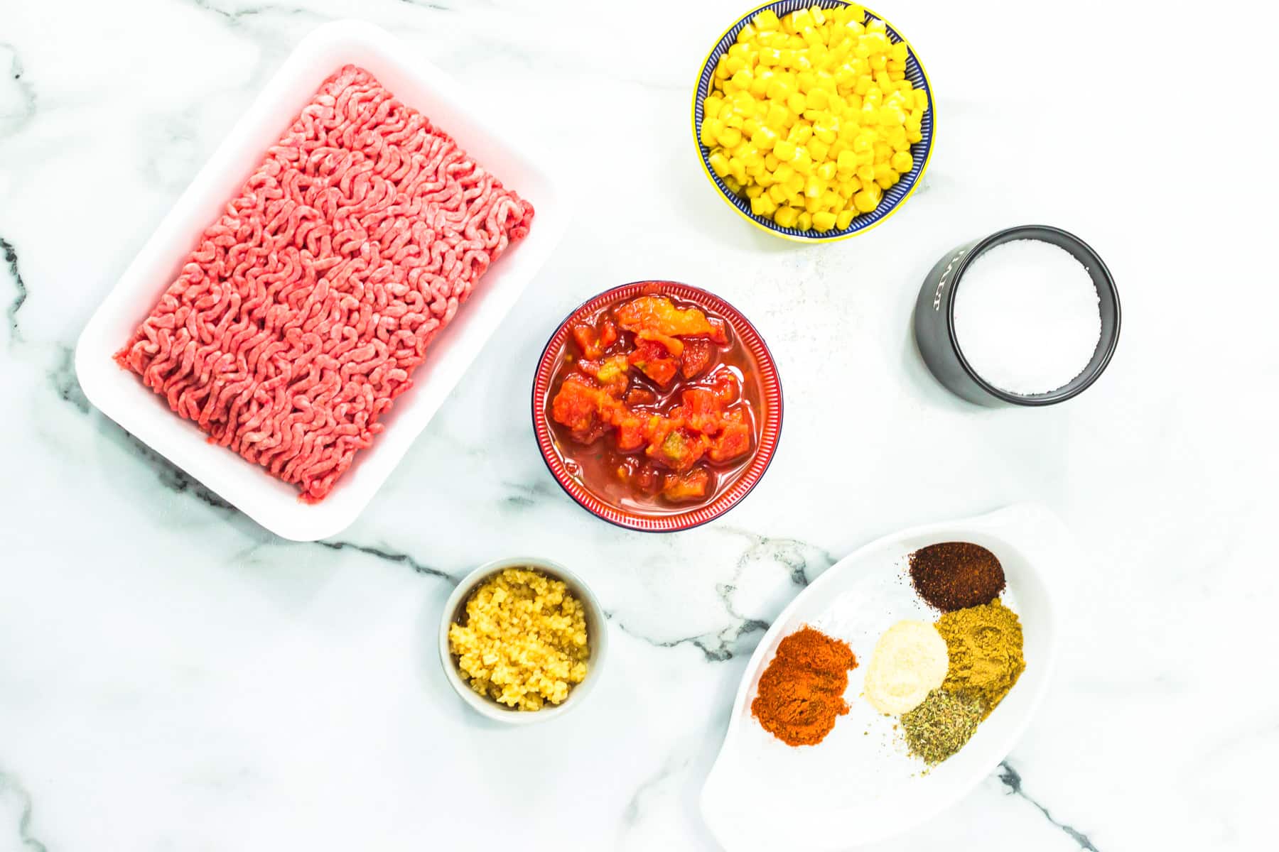 meat, corn, tomatoes, spices, milk.