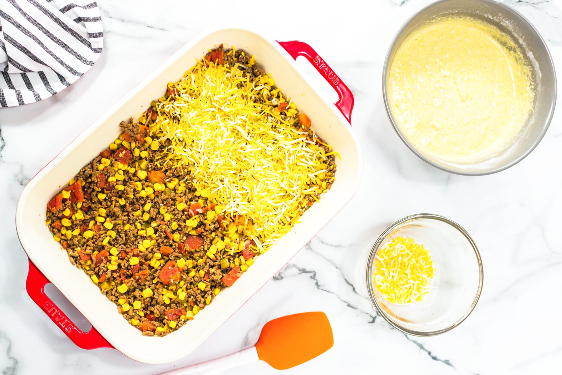 casserole dish with meat and cheese on top.