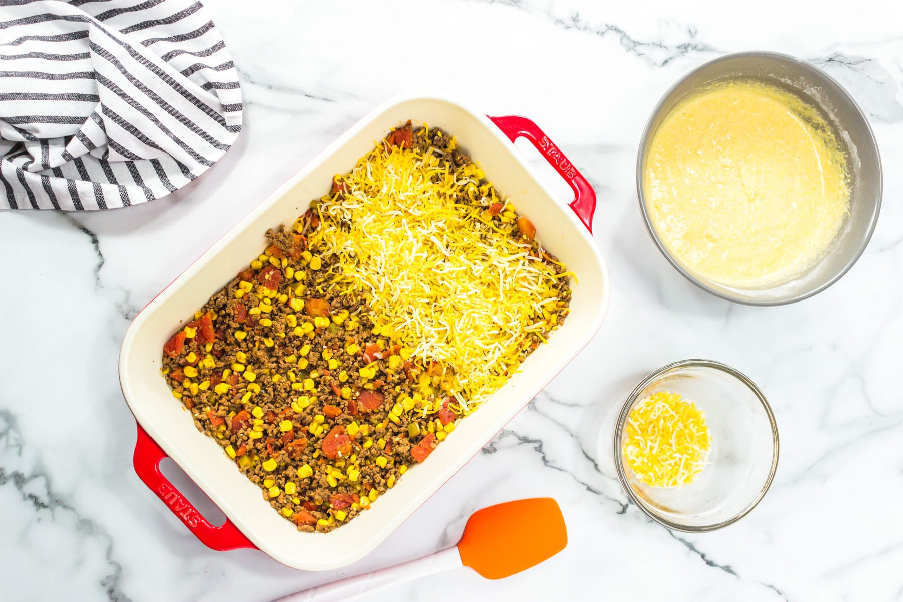 casserole dish with meat and cheese on top.