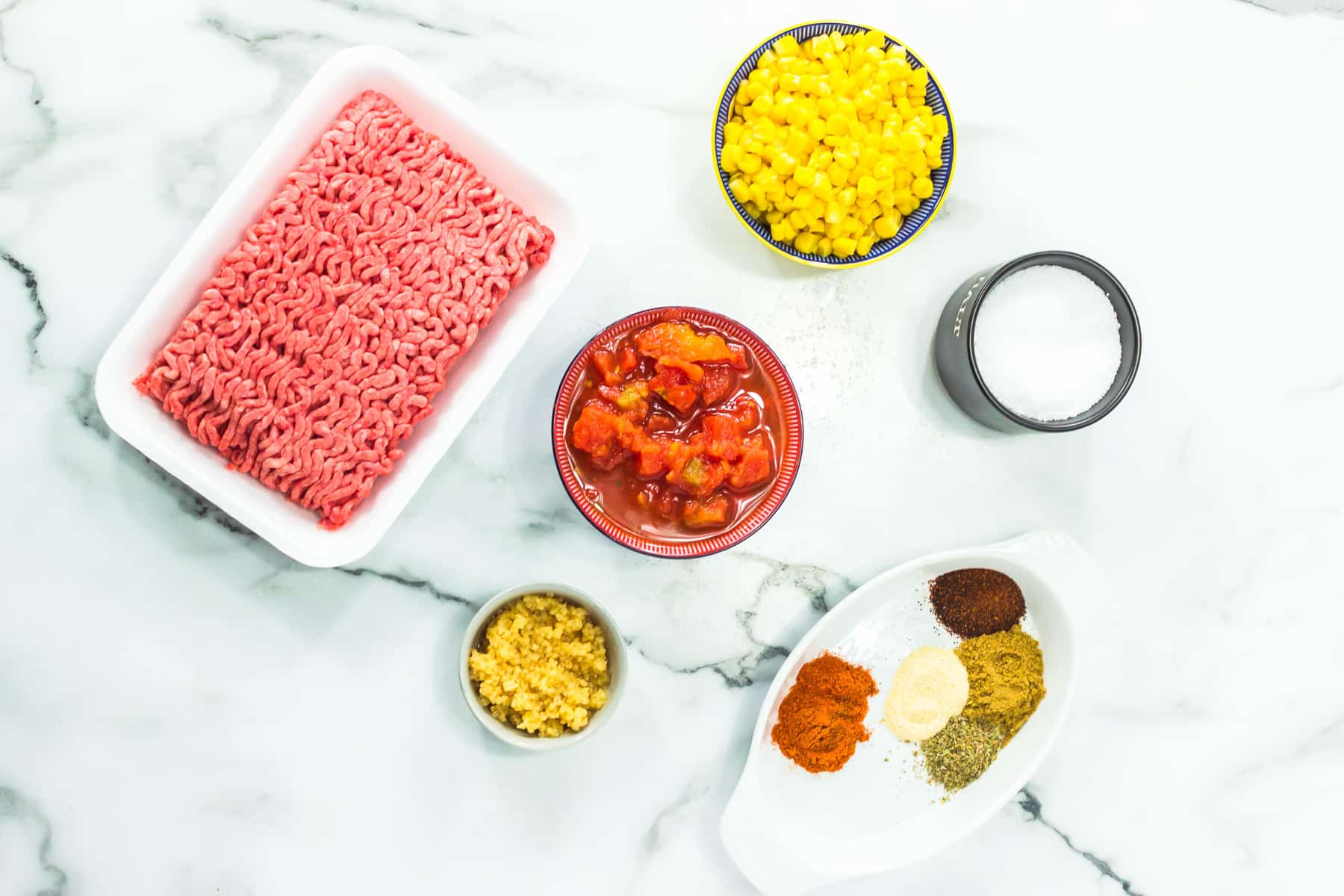 meat, corn, tomatoes, spices, milk.