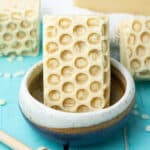 beeswax and honey soap in soap dish.