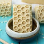beeswax and honey soap in soap dish.