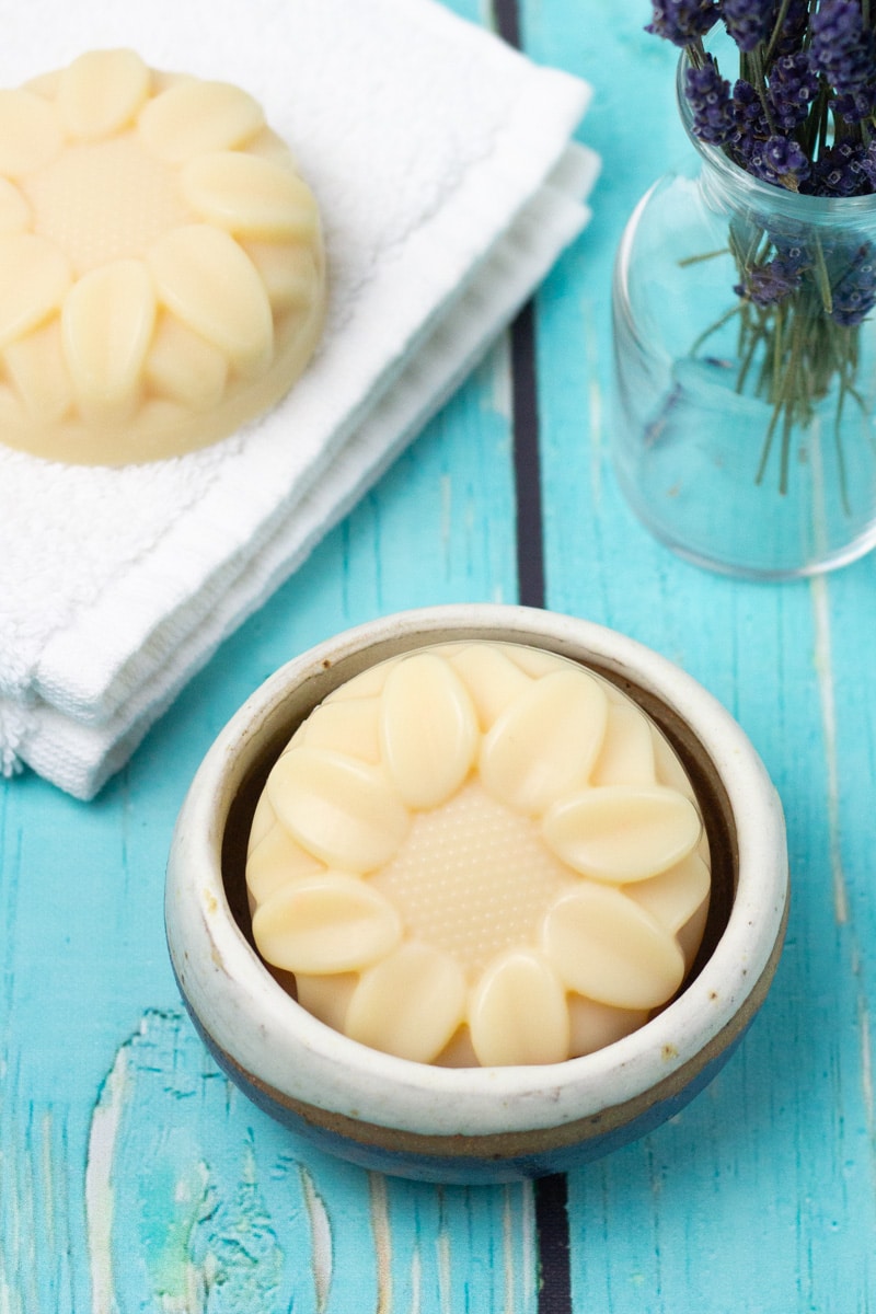 sunflower shaped lard soap in a soap dish.