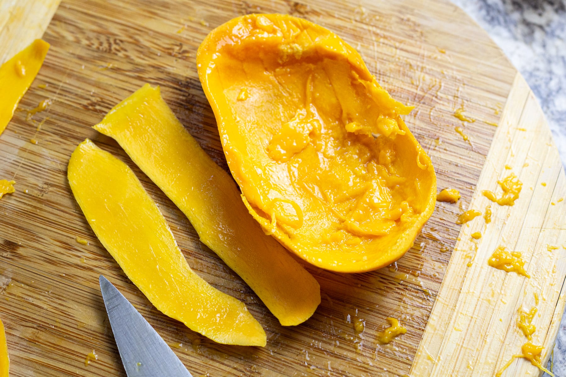 mango half with lots of mango still in it.